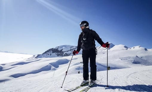 A man skiing down the mountains on the French Alps.